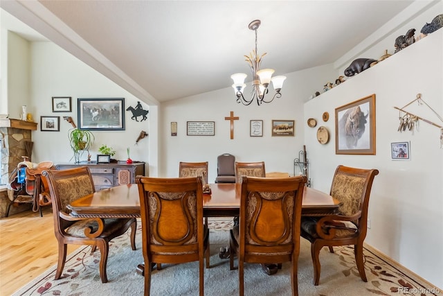 510 Park View Ln, Gypsum, CO 81637 - dining area with a chandelier, lofted ceiling, and wood finished floors