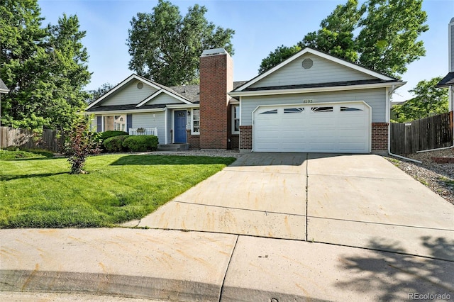 5193 S Flanders Ln, Centennial, CO 80015 - view of front of property with brick siding, a chimney, driveway, and an attached garage