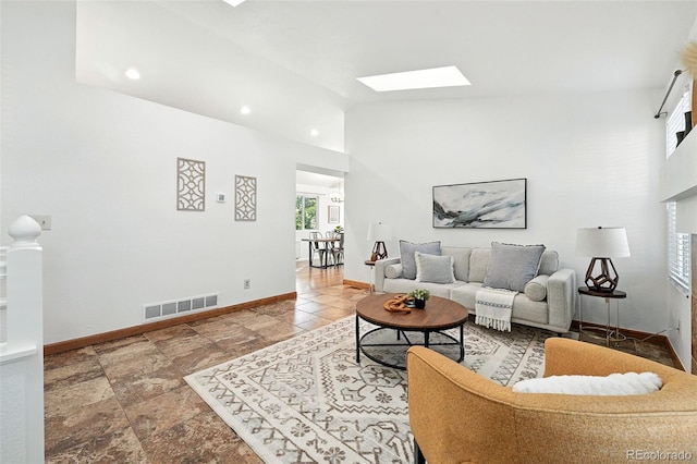 5193 S Flanders Ln, Centennial, CO 80015 - living area featuring a skylight, vaulted ceiling, and recessed lighting