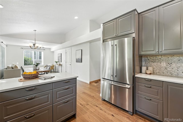 5193 S Flanders Ln, Centennial, CO 80015 - kitchen with high end refrigerator, gray cabinets, light wood-style floors, a chandelier, and recessed lighting
