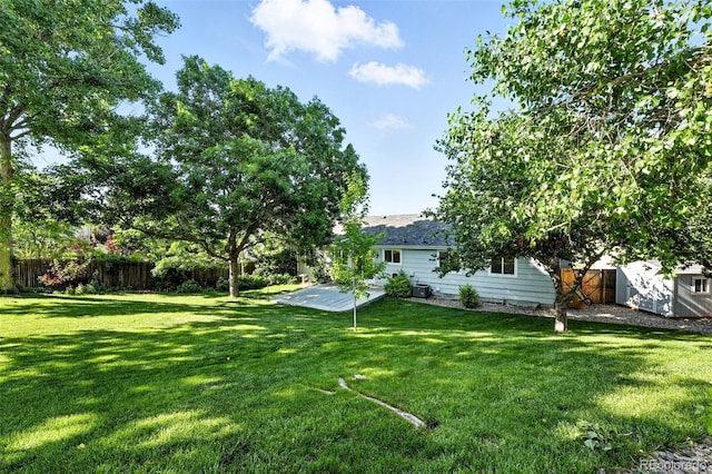 5193 S Flanders Ln, Centennial, CO 80015 - view of yard featuring a storage unit and a patio area