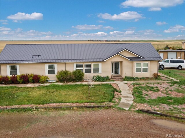 47855 E 88th Ave, Bennett, CO 80102 - ranch-style house with a front yard and metal roof
