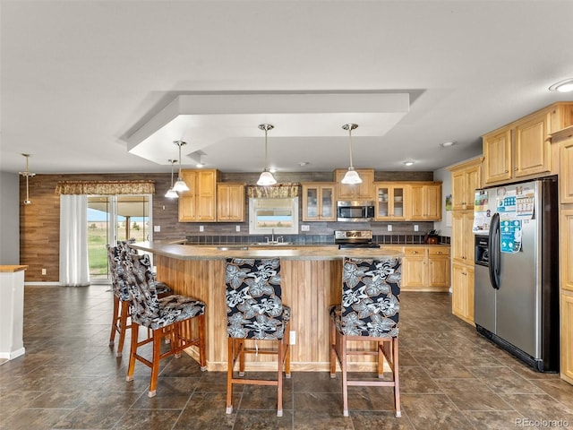 47855 E 88th Ave, Bennett, CO 80102 - kitchen featuring appliances with stainless steel finishes, a kitchen bar, glass insert cabinets, and backsplash
