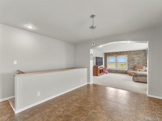 47855 E 88th Ave, Bennett, CO 80102 - unfurnished dining area featuring arched walkways and baseboards