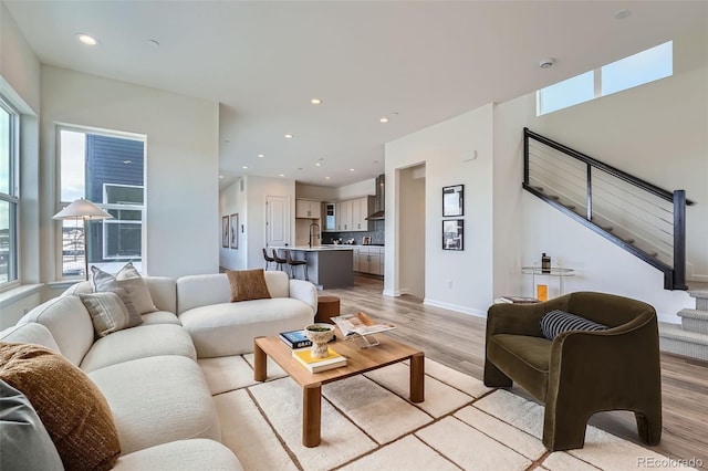 living room with light hardwood / wood-style flooring