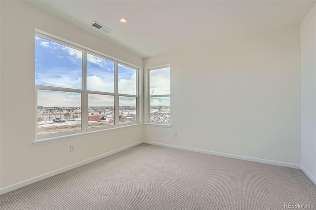 empty room with light colored carpet