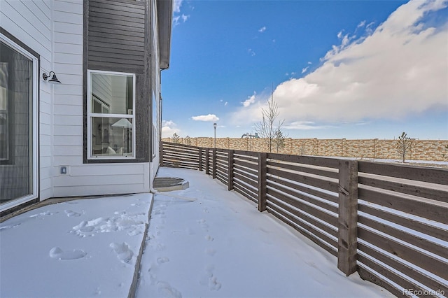 view of snow covered patio