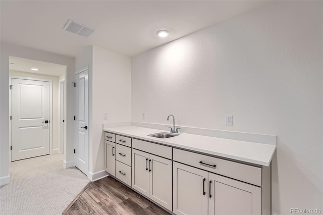 bathroom featuring vanity and hardwood / wood-style floors