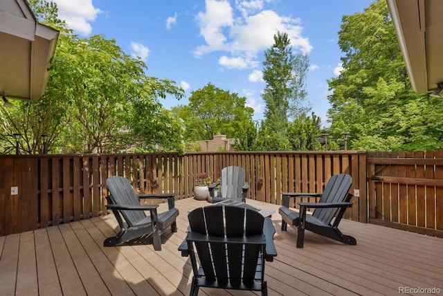 41 Eagle Dr, Littleton, CO 80123 - wooden deck with an outdoor fire pit