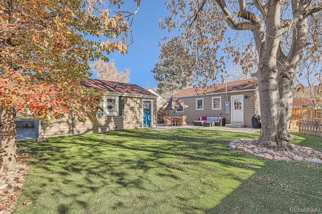 view of yard with an outdoor living space and a patio