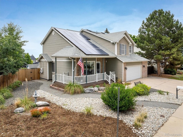 2777 W 106th Cir, Westminster, CO 80234 - traditional home with covered porch, a garage, solar panels, concrete driveway, and roof with shingles