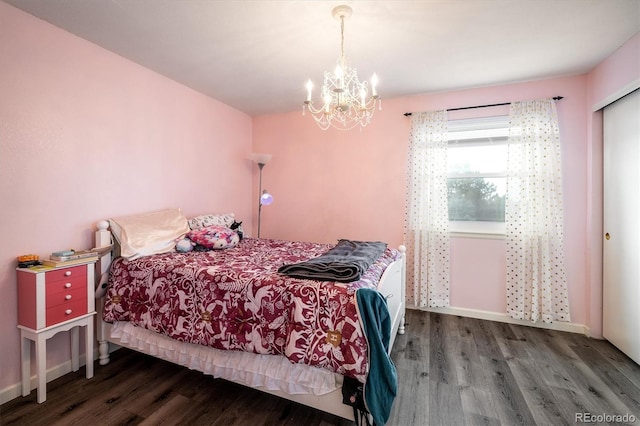 2777 W 106th Cir, Westminster, CO 80234 - bedroom with wood finished floors, a chandelier, and a closet