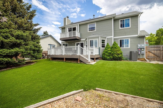 2777 W 106th Cir, Westminster, CO 80234 - back of property featuring a balcony, a wooden deck, and a chimney