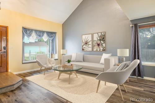 2777 W 106th Cir, Westminster, CO 80234 - living area with wood finished floors and high vaulted ceiling