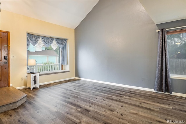 2777 W 106th Cir, Westminster, CO 80234 - unfurnished living room with lofted ceiling and wood finished floors
