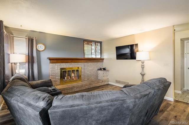 2777 W 106th Cir, Westminster, CO 80234 - living room featuring a fireplace and wood finished floors
