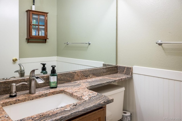 2777 W 106th Cir, Westminster, CO 80234 - bathroom featuring vanity and a wainscoted wall