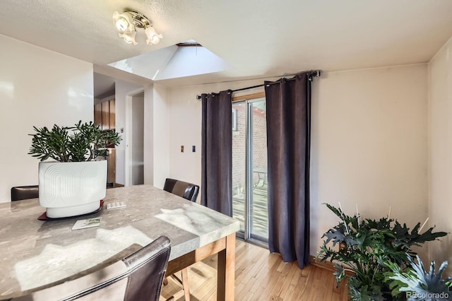 dining space featuring light wood-type flooring