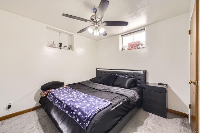 bedroom featuring carpet flooring, baseboards, and a ceiling fan