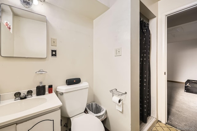 bathroom with toilet and vanity
