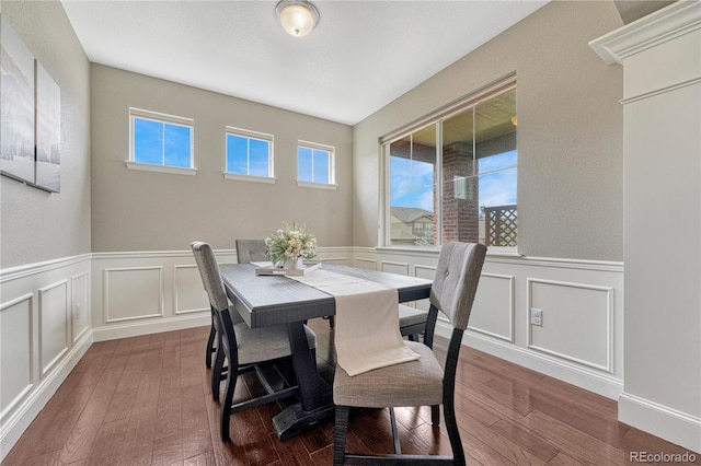 dining area with dark hardwood / wood-style floors