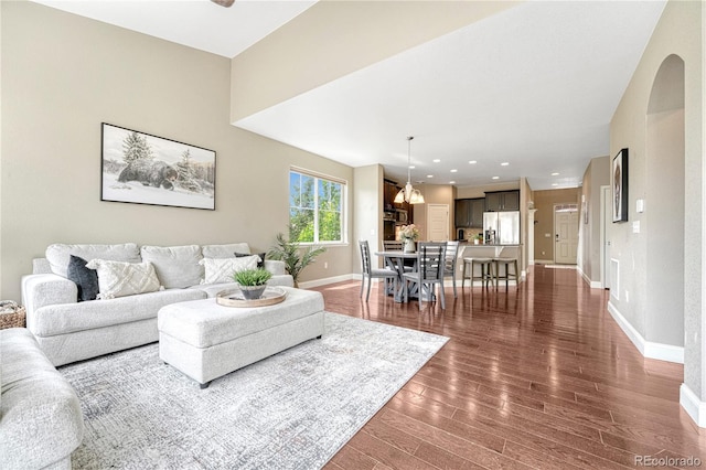 19382 Dunraven St, Parker, CO 80134 - living area with dark wood-style flooring and recessed lighting