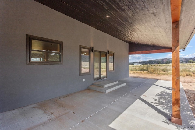 view of patio / terrace featuring a mountain view