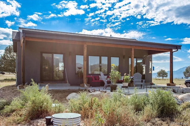 rear view of property with a patio area