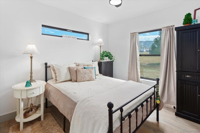 bedroom with light wood-type flooring