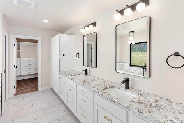 bathroom featuring vanity and tile patterned floors