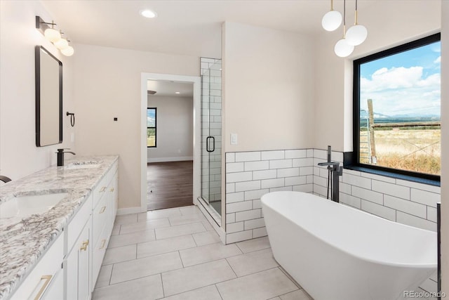 bathroom featuring vanity, tile patterned floors, and separate shower and tub