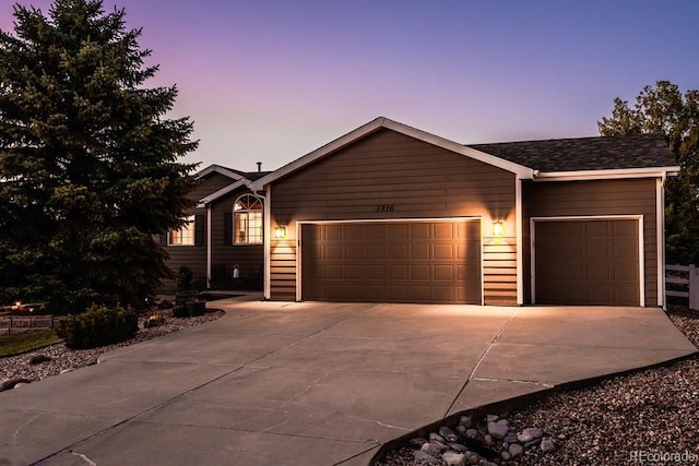 ranch-style home featuring a garage