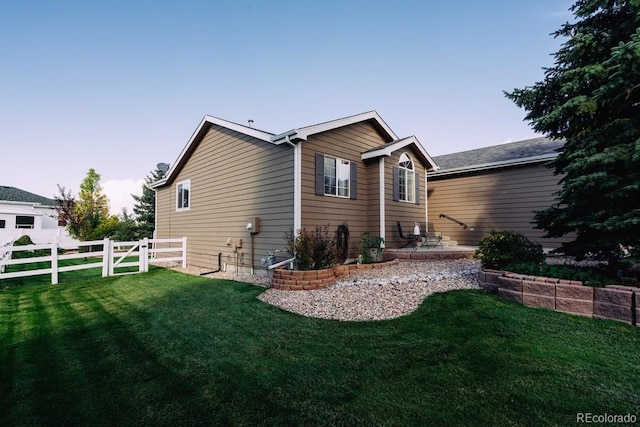 rear view of house with a lawn