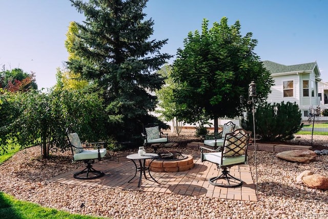 exterior space with a fire pit and a patio area