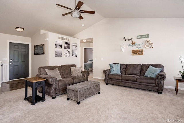 carpeted living room featuring high vaulted ceiling and ceiling fan