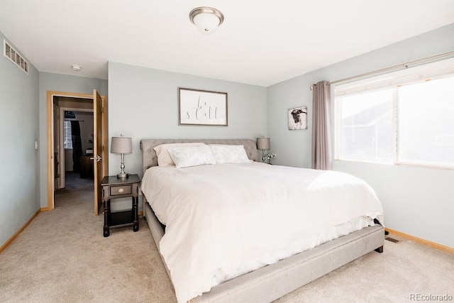 bedroom with light carpet