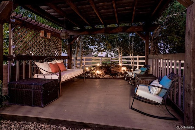 deck at dusk with an outdoor living space