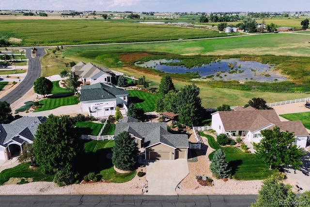 drone / aerial view with a rural view and a water view