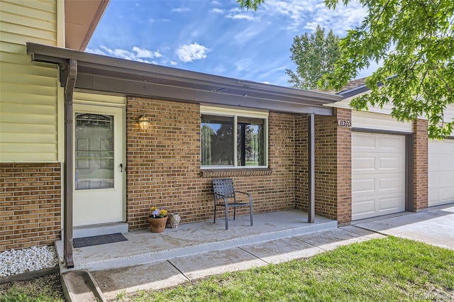 11310 W 46th Ave, Wheat Ridge, CO 80033 - entrance to property with brick siding and a garage