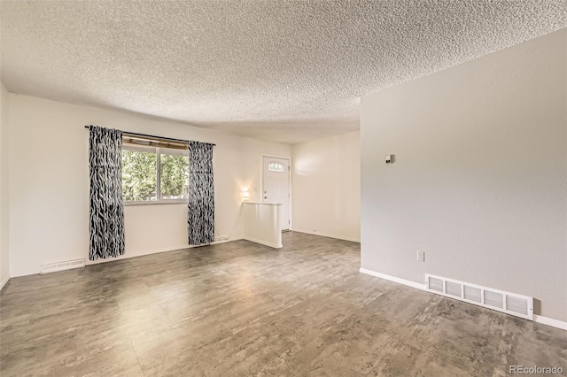 11310 W 46th Ave, Wheat Ridge, CO 80033 - unfurnished room featuring a textured ceiling and baseboards