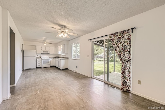11310 W 46th Ave, Wheat Ridge, CO 80033 - unfurnished living room with ceiling fan, a textured ceiling, and baseboards