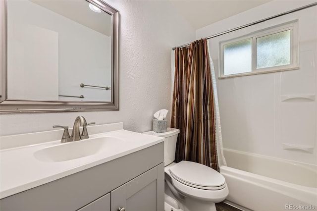 11310 W 46th Ave, Wheat Ridge, CO 80033 - full bath featuring vanity, toilet, a textured wall, and shower / tub combo