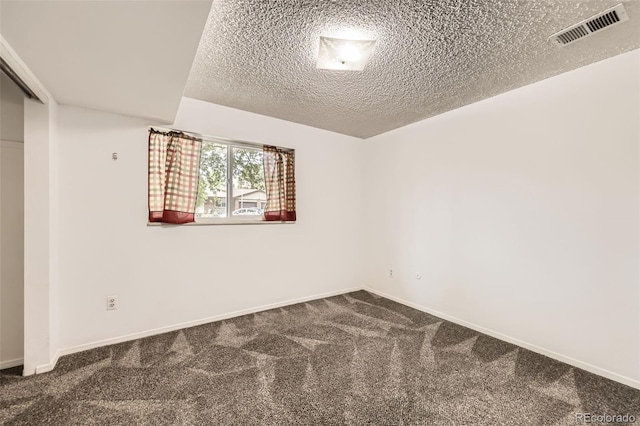11310 W 46th Ave, Wheat Ridge, CO 80033 - carpeted spare room featuring a textured ceiling and baseboards