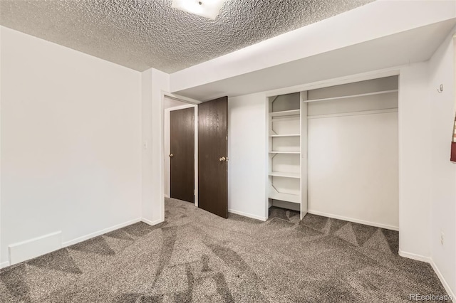 11310 W 46th Ave, Wheat Ridge, CO 80033 - unfurnished bedroom with carpet flooring, a textured ceiling, baseboards, and a closet