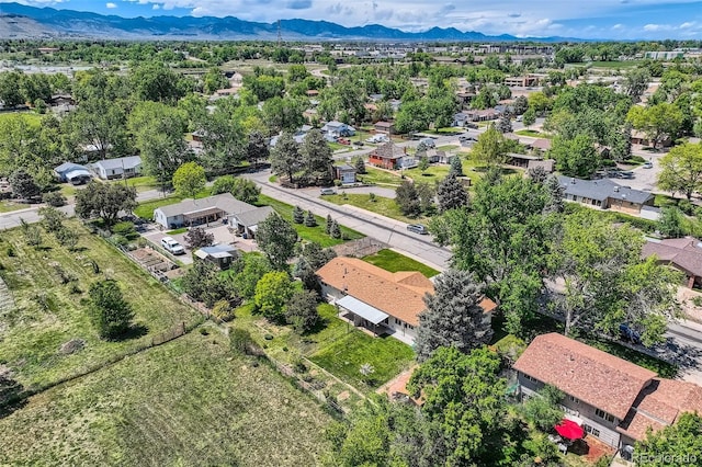 11310 W 46th Ave, Wheat Ridge, CO 80033 - aerial perspective of suburban area featuring a mountain backdrop