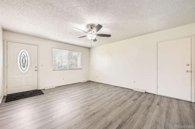 11310 W 46th Ave, Wheat Ridge, CO 80033 - entrance foyer with a ceiling fan, wood finished floors, and a textured ceiling