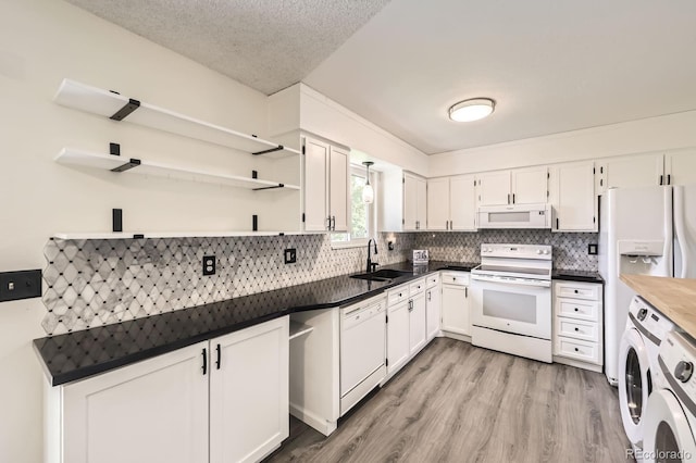 11310 W 46th Ave, Wheat Ridge, CO 80033 - kitchen with white appliances, a sink, open shelves, decorative backsplash, and a textured ceiling