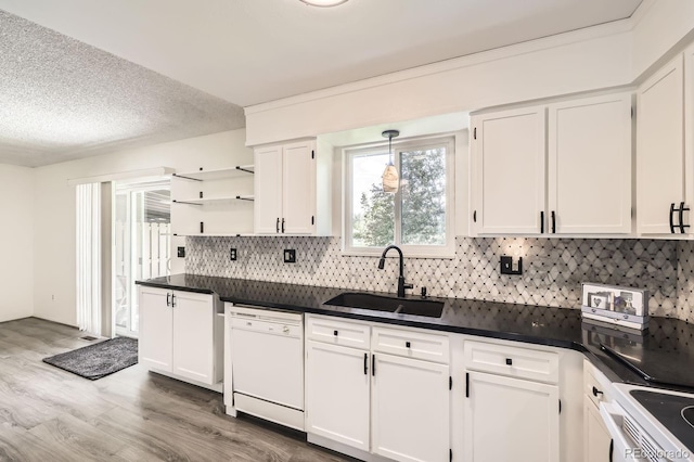 11310 W 46th Ave, Wheat Ridge, CO 80033 - kitchen featuring a sink, white appliances, white cabinetry, dark countertops, and a textured ceiling