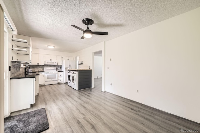 11310 W 46th Ave, Wheat Ridge, CO 80033 - kitchen featuring white appliances, wood finished floors, a ceiling fan, a textured ceiling, and dark countertops