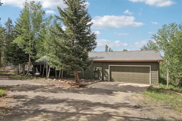 1021 Lodge Pole Dr, Black Hawk, CO 80422 - view of front of property with driveway and an attached garage